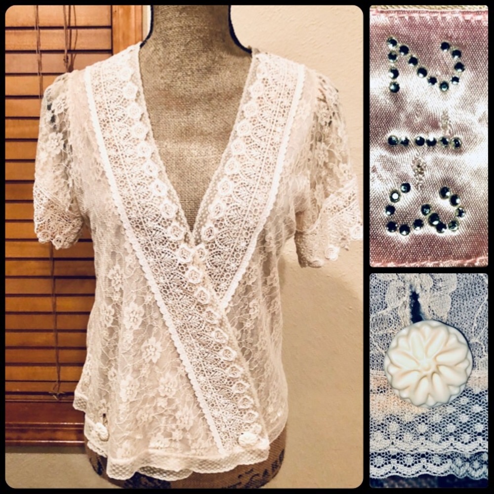 Super feminine lace wrap shirt. Hangs really well.